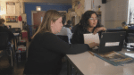 Teacher helping student at West Belden, a community school